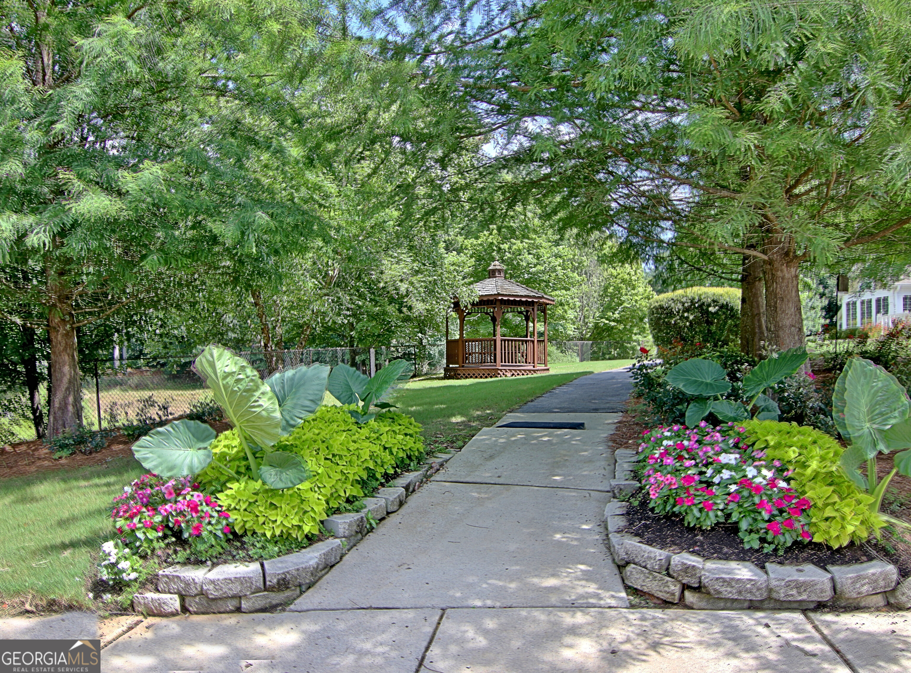 265 Rehobeth Way Fayetteville, GA 30214 - Photo 61 of 63 a view of a garden with flowers and trees