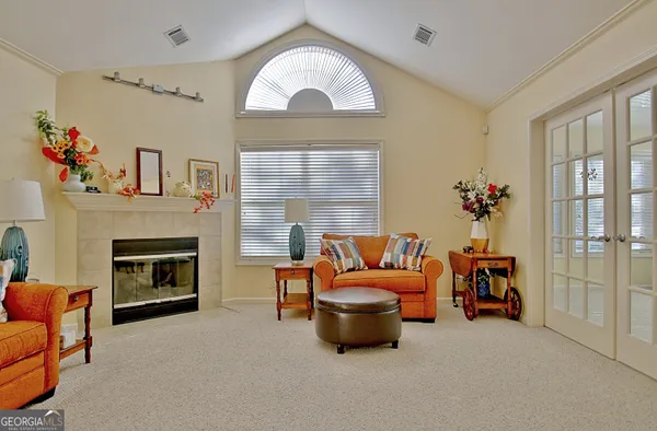 a living room with furniture and a fireplace