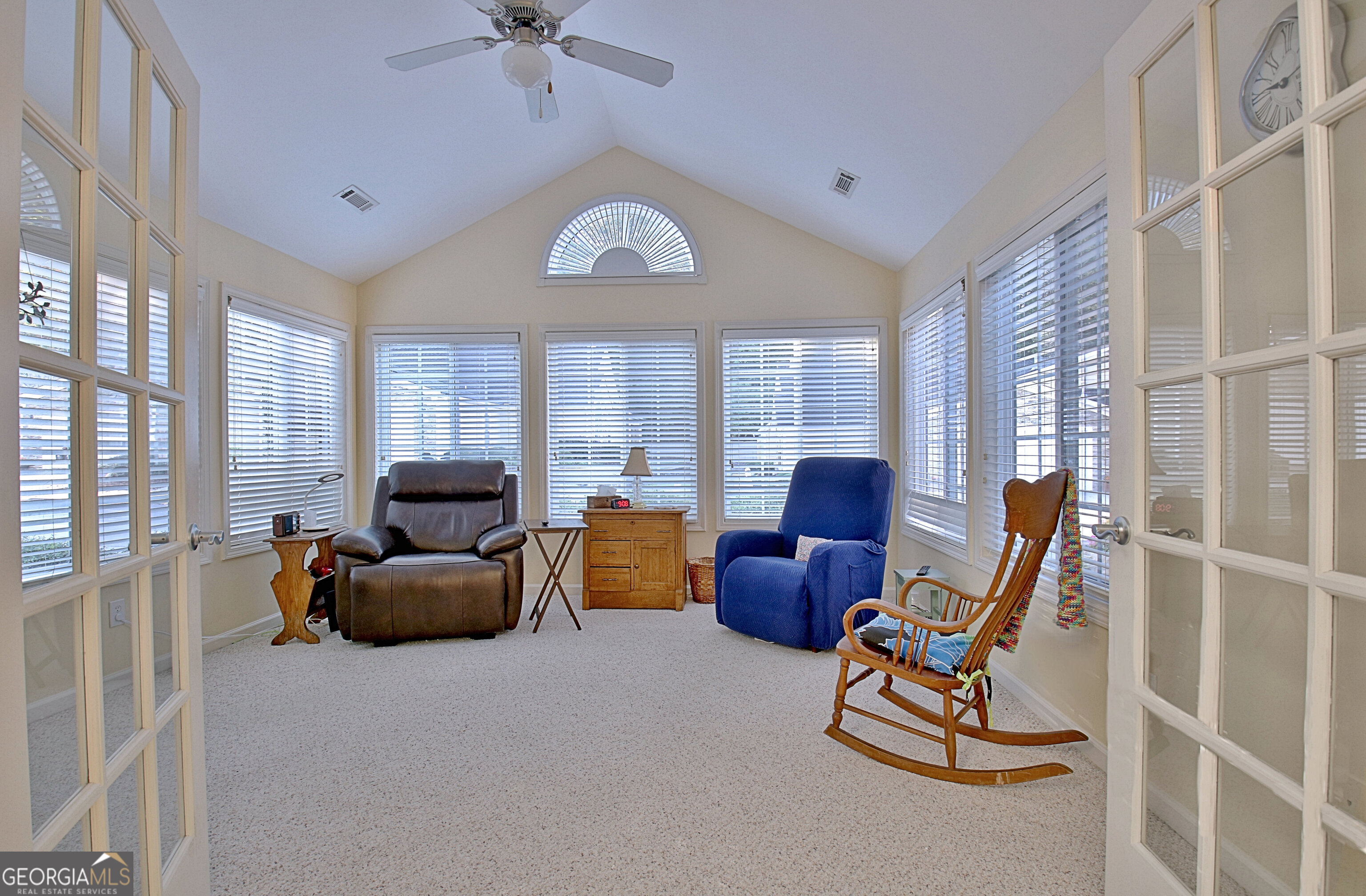 265 Rehobeth Way Fayetteville, GA 30214 - Photo 8 of 63 a living room with furniture a fireplace and a large window