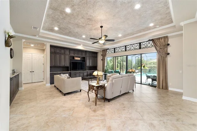 a view of a dining room with furniture wooden floor and chandelier