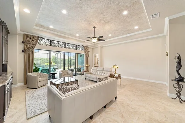 a kitchen with stainless steel appliances granite countertop a refrigerator and a stove