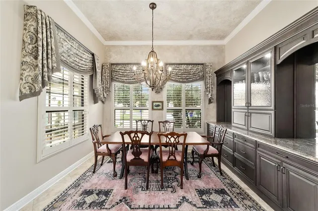 a kitchen with granite countertop a sink a counter top space and stainless steel appliances