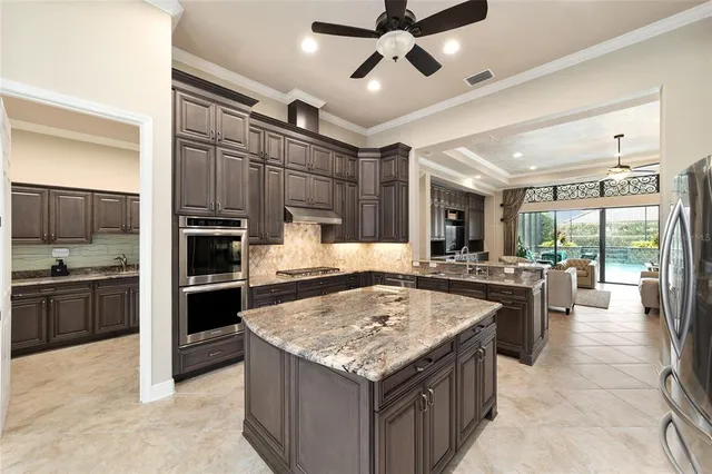 a bathroom with a granite countertop sink mirror and shower