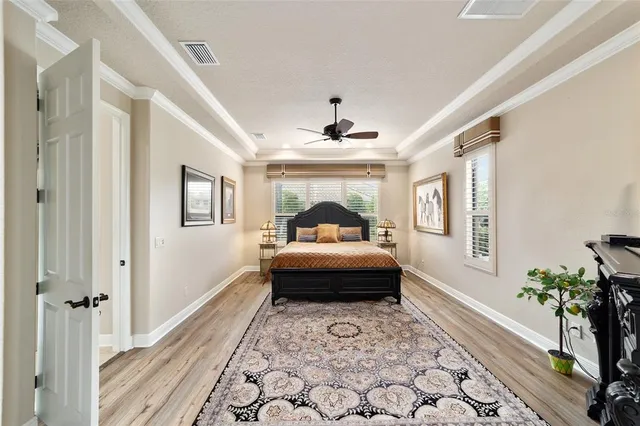 a bathroom with double vanity sinks and a shower