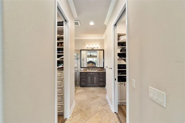 a view of a livingroom with furniture a ceiling fan and wooden floor