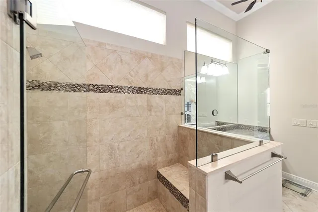 a bathroom with a granite countertop sink toilet a large mirror and shower