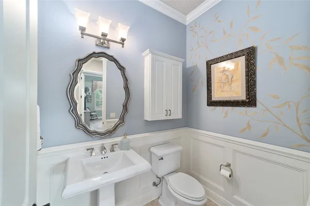 a swimming pool with outdoor seating and green space