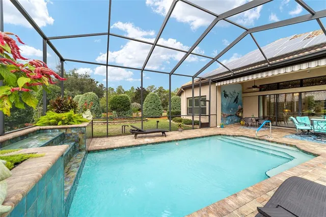 an aerial view of a house with a ocean view