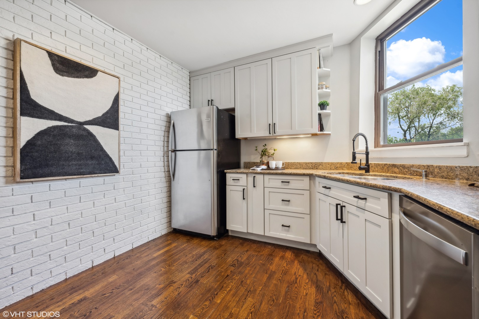 1050 West Byron Street, Unit 3W Chicago, IL 60613 - Photo 11 of 23 a kitchen with a sink cabinets and a large window