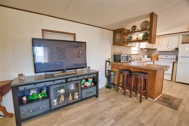 a room with furniture and a flat screen tv