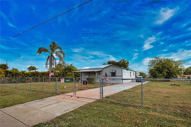 a view of a house with a big yard