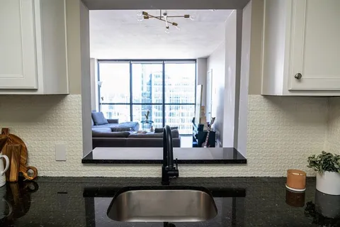 a bedroom with a bed and a table