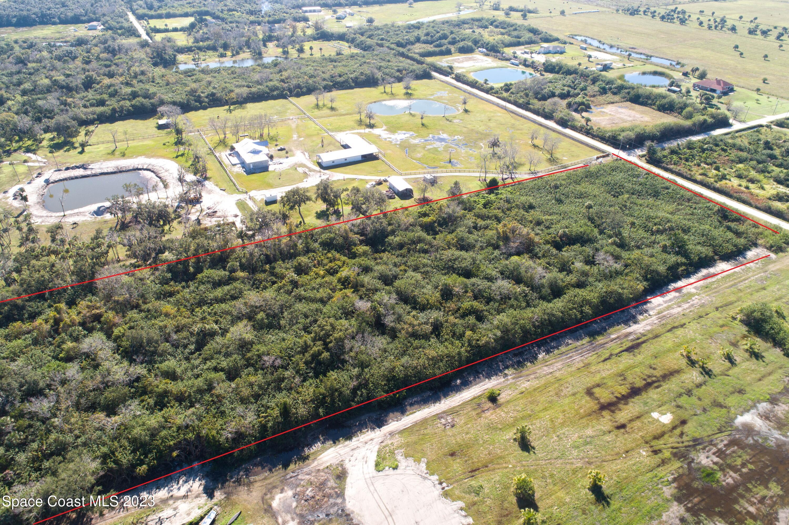 3495 Hammock Road Mims, FL 32754 - Photo 11 of 20 a view of a lake from a balcony