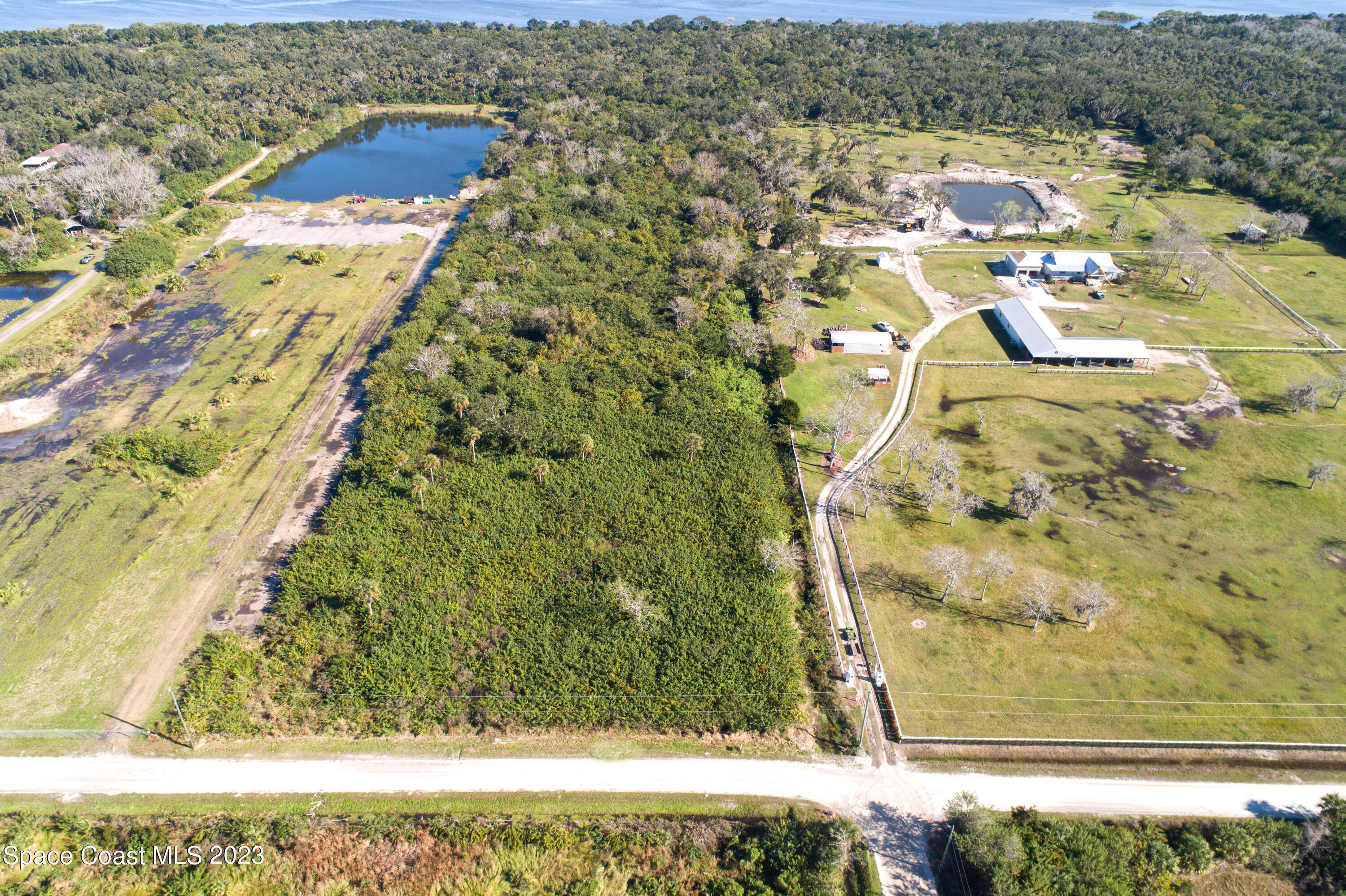 3495 Hammock Road Mims, FL 32754 - Photo 2 of 20 a view of residential houses with yard