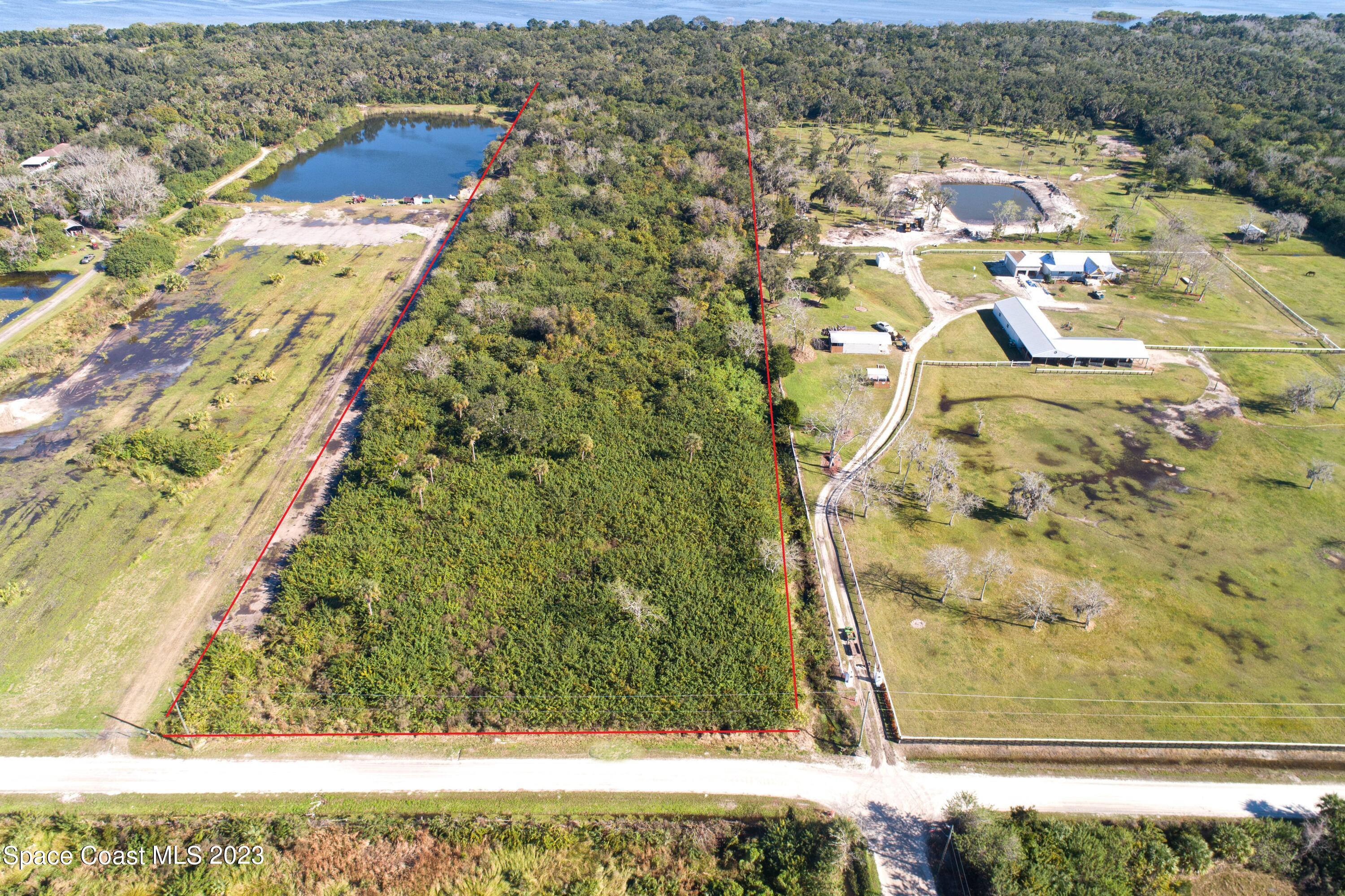 3495 Hammock Road Mims, FL 32754 - Photo 3 of 20 a view of residential houses with outdoor space
