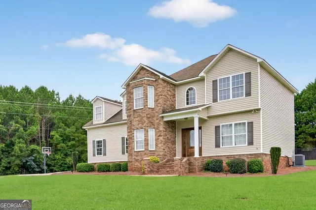 front view of a house with a yard