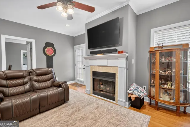 a bedroom with a bed and a ceiling fan