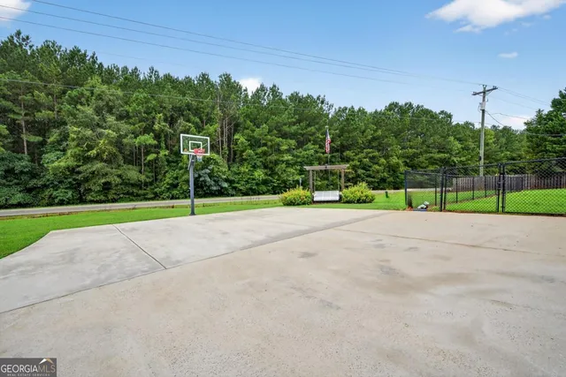 a view of a park with large trees