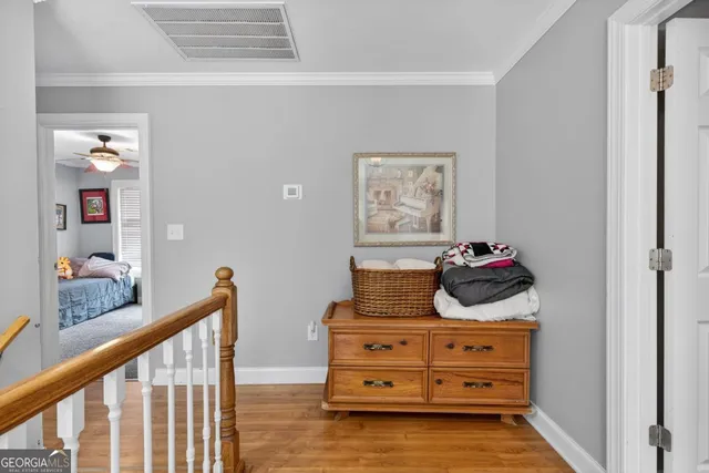 a living room with furniture a flat screen tv and a flat screen tv