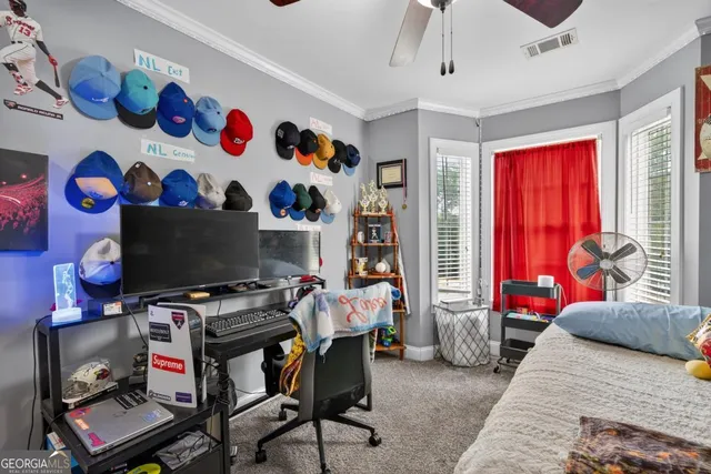 a living room with furniture gym equipment and a flat screen tv