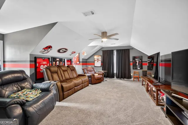 a view of a house with a big yard and large trees