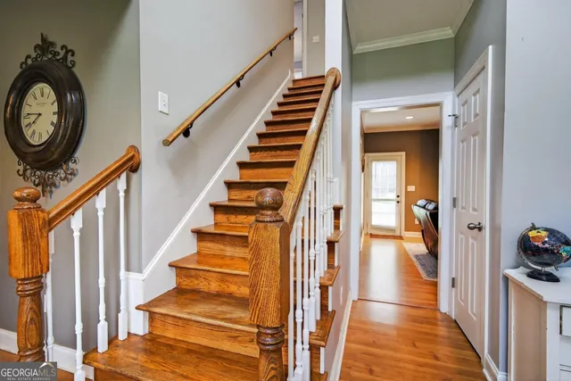a workspace with furniture a flat screen tv and a fireplace