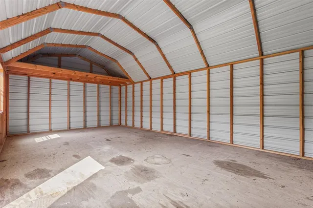 a view of an empty room with a staircase