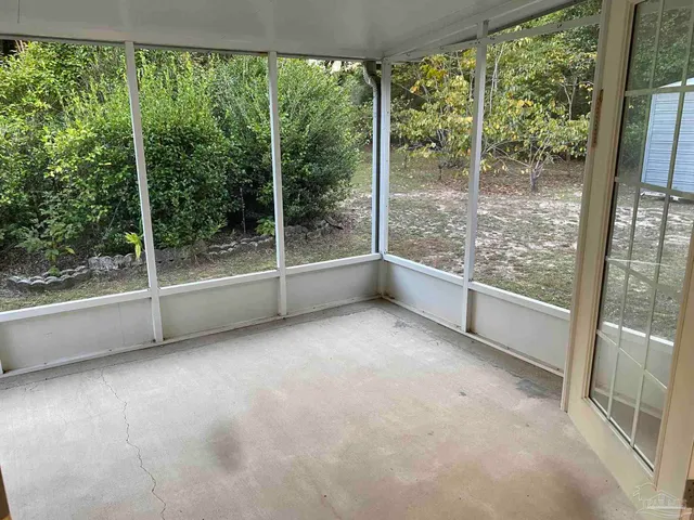 a view of a house with a yard and balcony