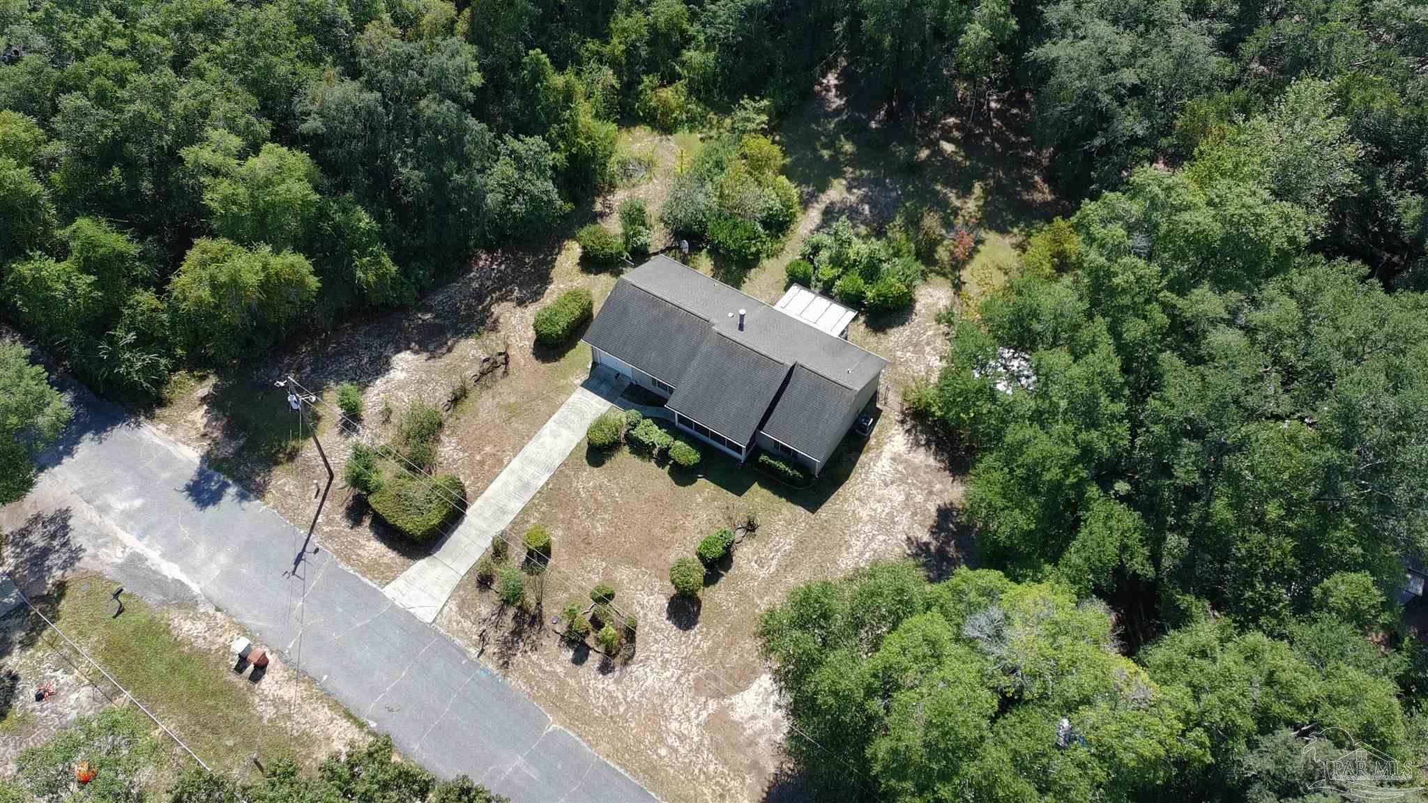 6333 Rice Street Milton, FL 32583 - Photo 3 of 19 an aerial view of a house with a yard