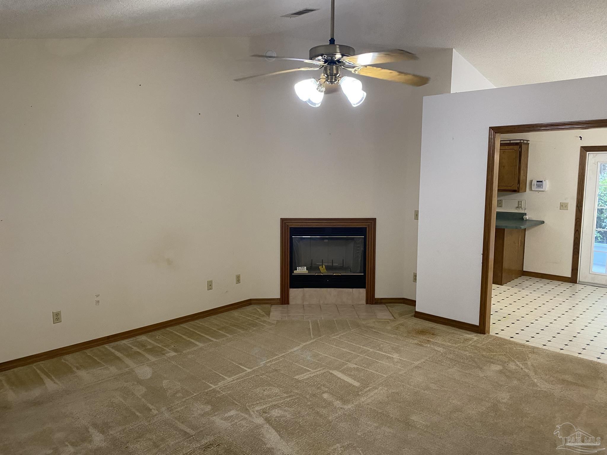 6333 Rice Street Milton, FL 32583 - Photo 4 of 19 a view of an empty room with a fireplace