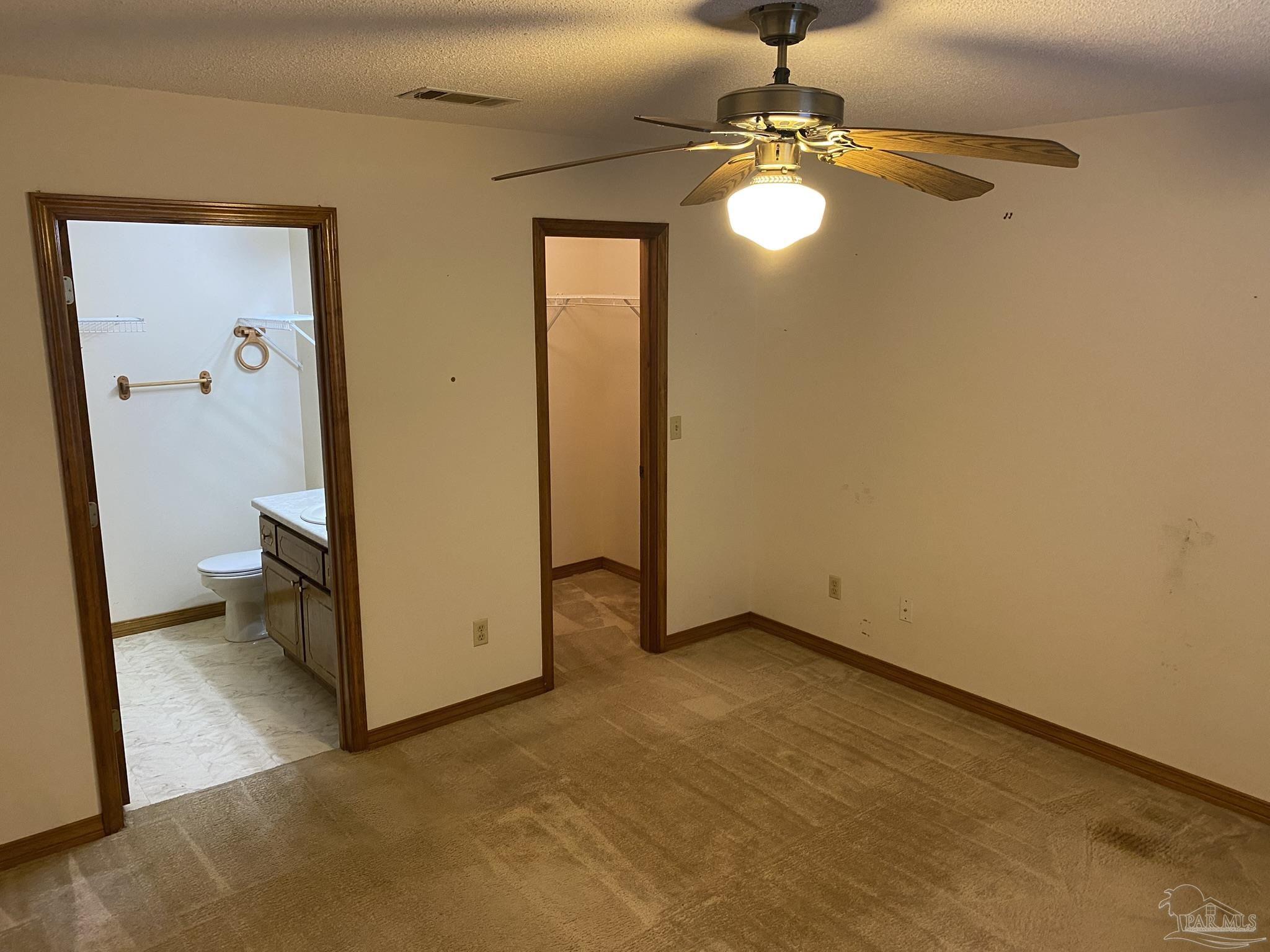 6333 Rice Street Milton, FL 32583 - Photo 9 of 19 an empty room with windows and entrance