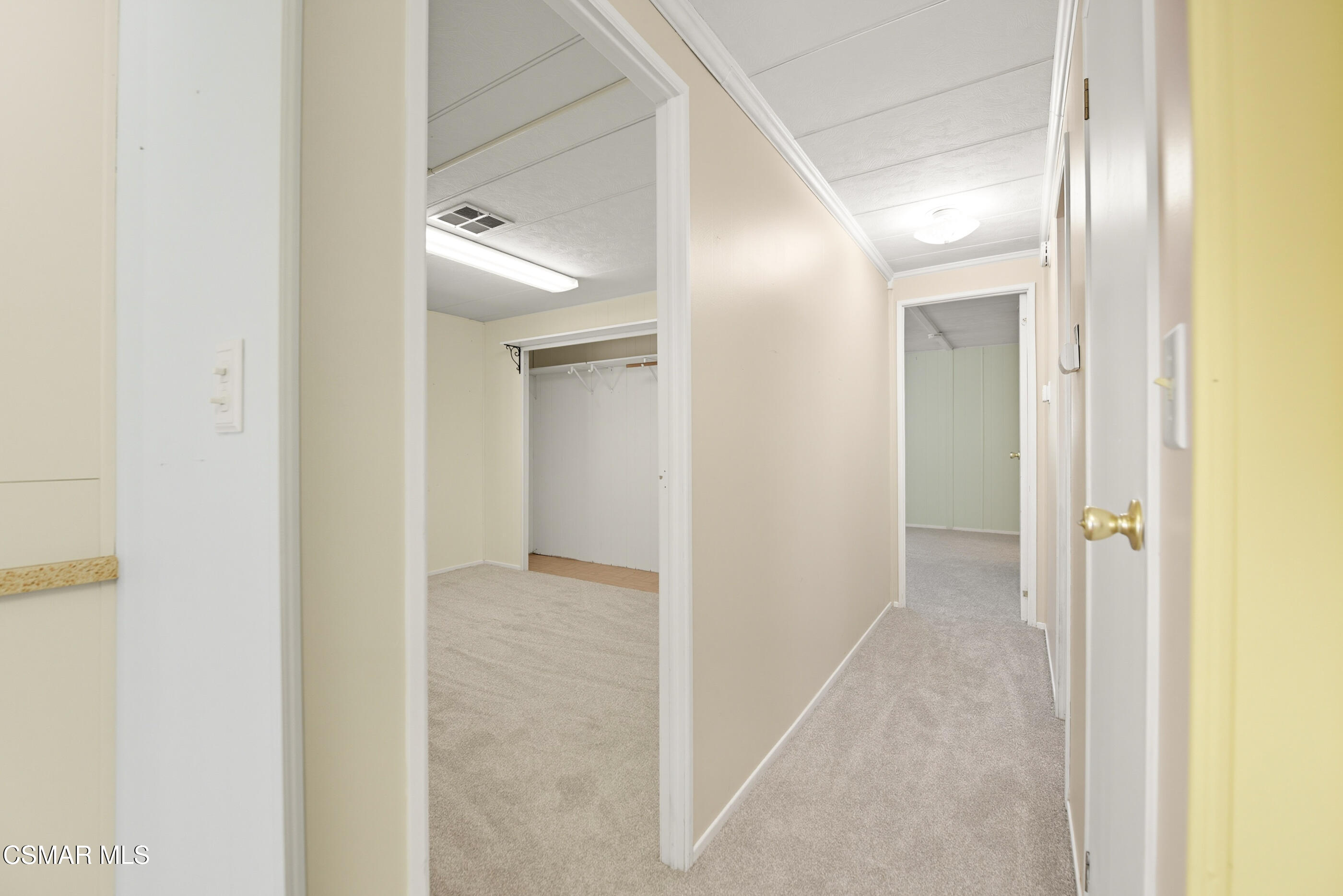 195 Tierra Rejada Road, Unit 178 Simi Valley, CA 93065 - Photo 16 of 49 a view of a hallway with wooden floor