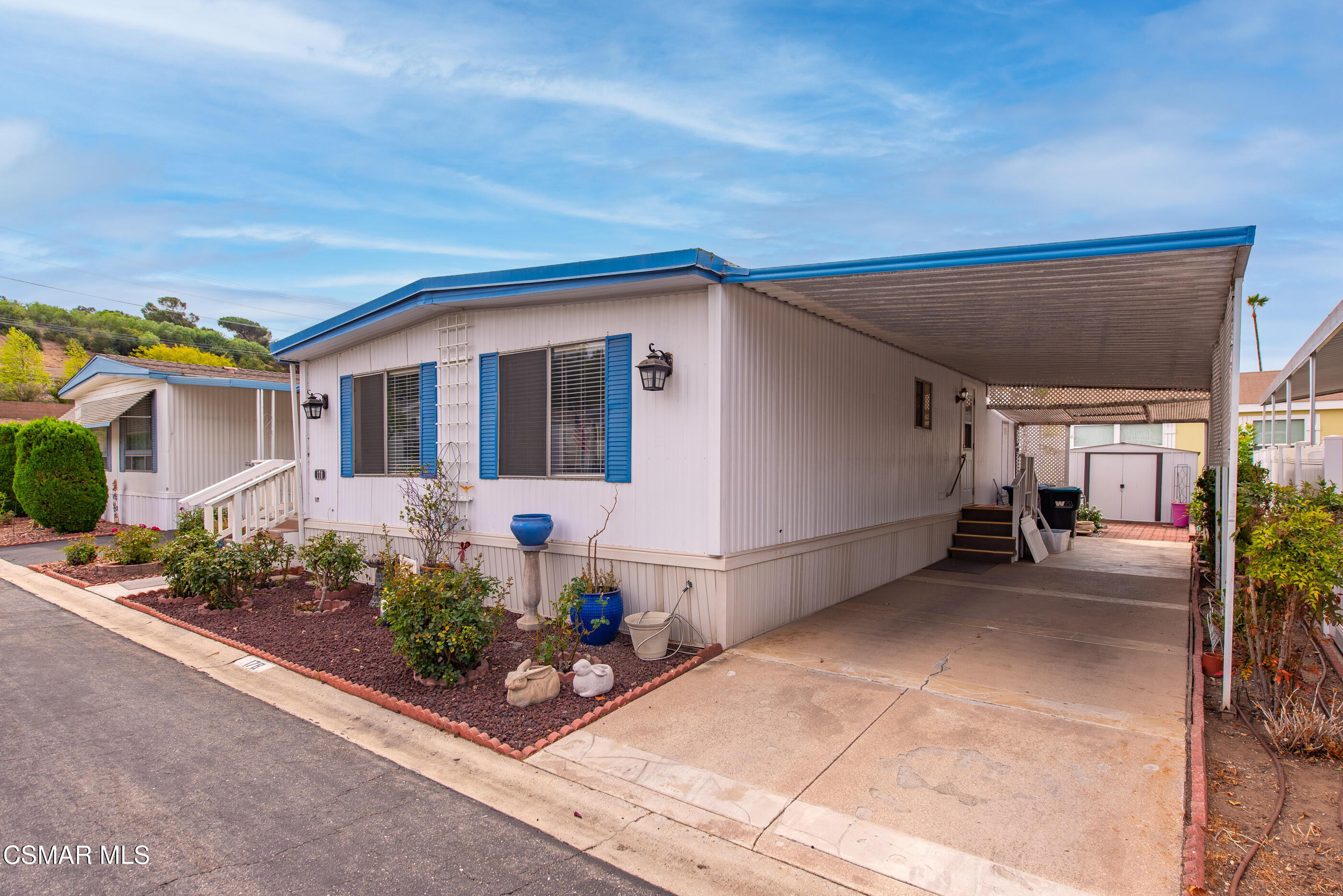 195 Tierra Rejada Road, Unit 178 Simi Valley, CA 93065 - Photo 2 of 49 a front view of a house with potted plants