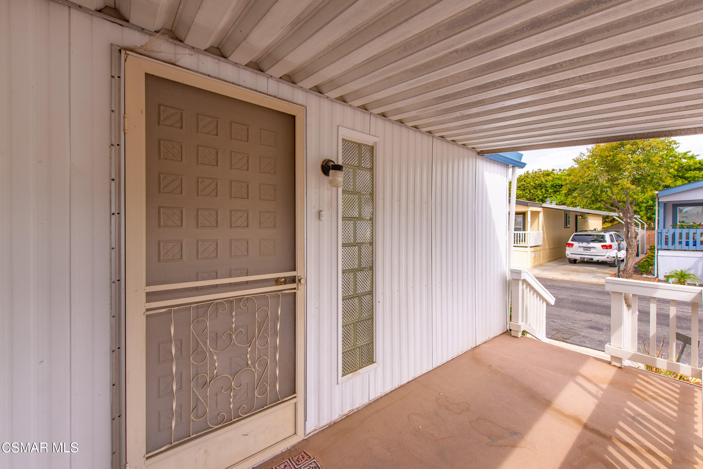 195 Tierra Rejada Road, Unit 178 Simi Valley, CA 93065 - Photo 3 of 49 a view of a porch with wooden floor and a fireplace
