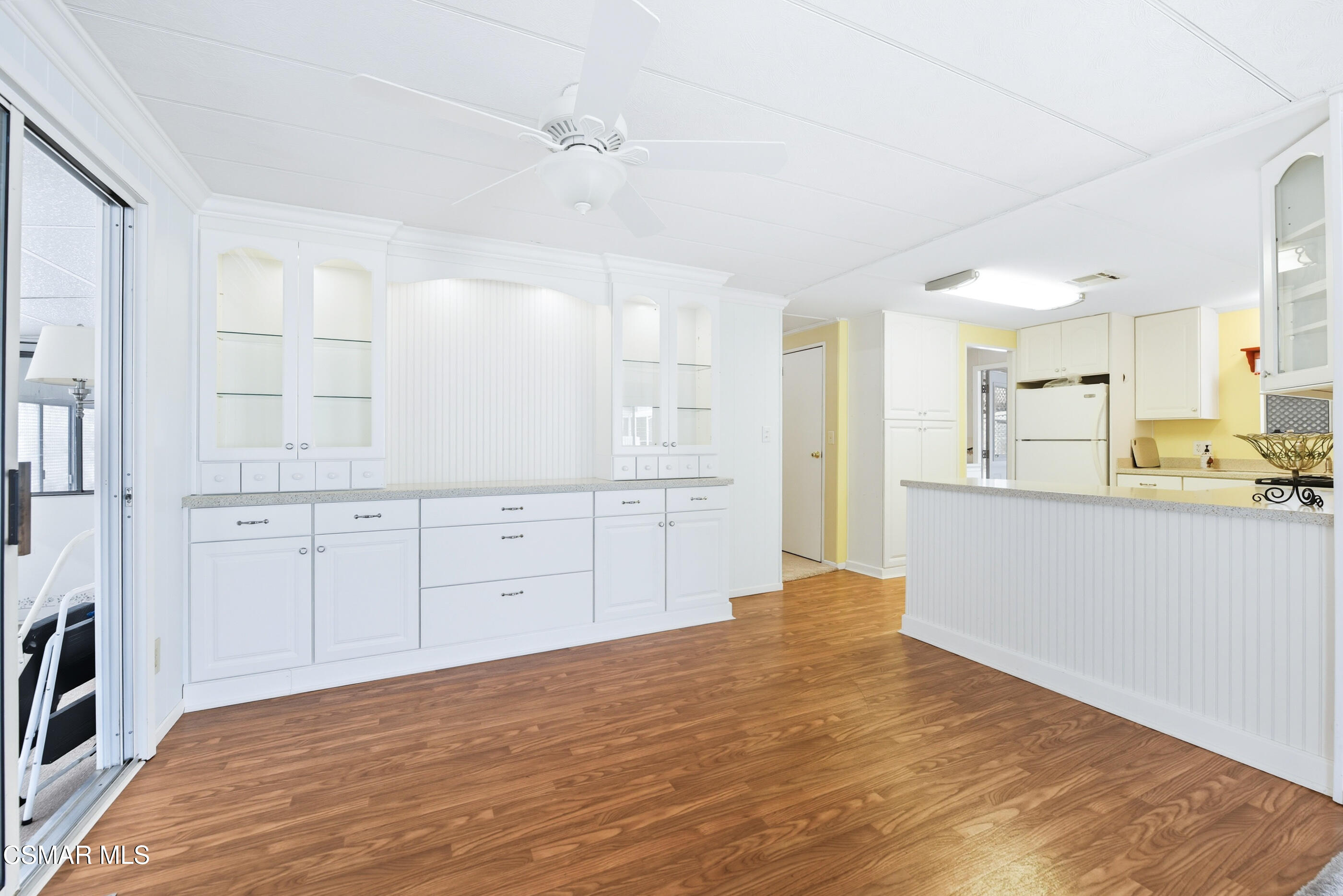 195 Tierra Rejada Road, Unit 178 Simi Valley, CA 93065 - Photo 7 of 49 a view of a kitchen with white cabinets