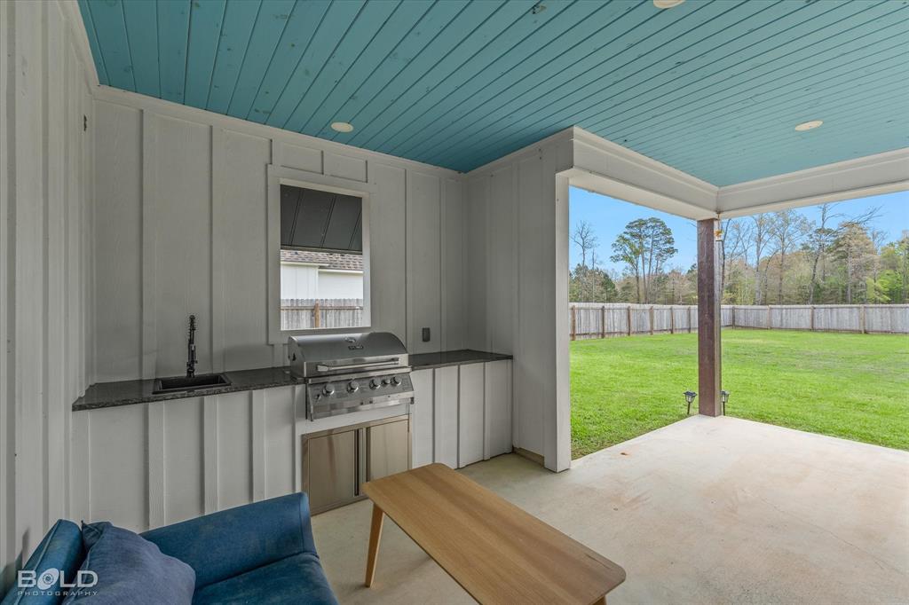 177 Sitka Loop Haughton, LA 71037 - Photo 34 of 38 Outdoor Kitchen with Haint Blue Ceiling