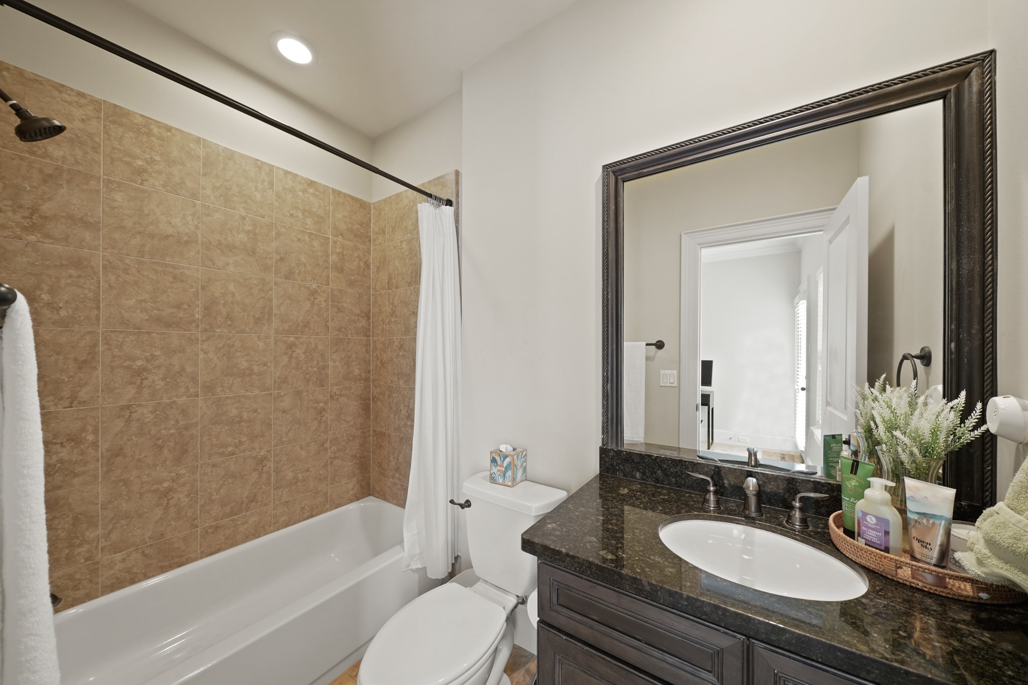 3808 Center Street, Unit A Houston, TX 77007 - Photo 28 of 31 a bathroom with a granite countertop sink toilet and shower