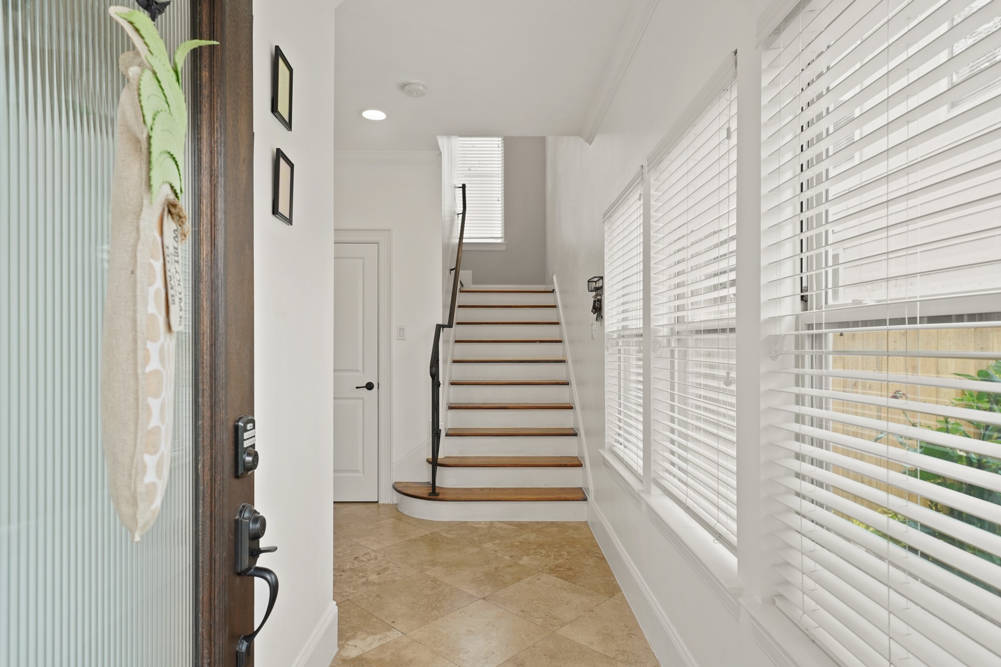 3808 Center Street, Unit A Houston, TX 77007 - Photo 3 of 31 a view of a hallway with stairs and a window