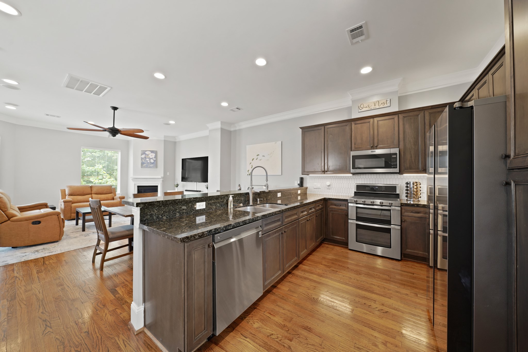 3808 Center Street, Unit A Houston, TX 77007 - Photo 6 of 31 a kitchen with stainless steel appliances granite countertop a sink stove and refrigerator