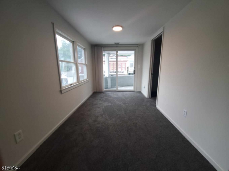 2 Main Street, Unit 1 Branchville, NJ 07826 - Photo 3 of 11 an empty room with windows