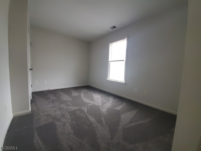 2 Main Street, Unit 1 Branchville, NJ 07826 - Photo 7 of 11 an empty room with windows