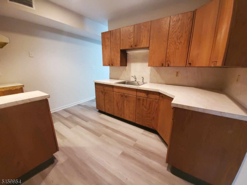 2 Main Street, Unit 1 Branchville, NJ 07826 - Photo 9 of 11 a room with a sink and cabinets