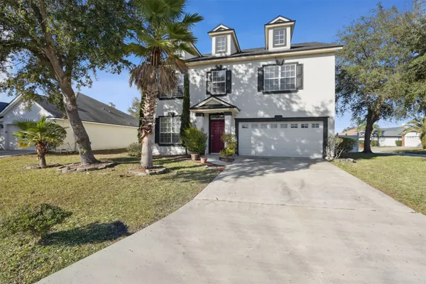 a front view of house with a yard