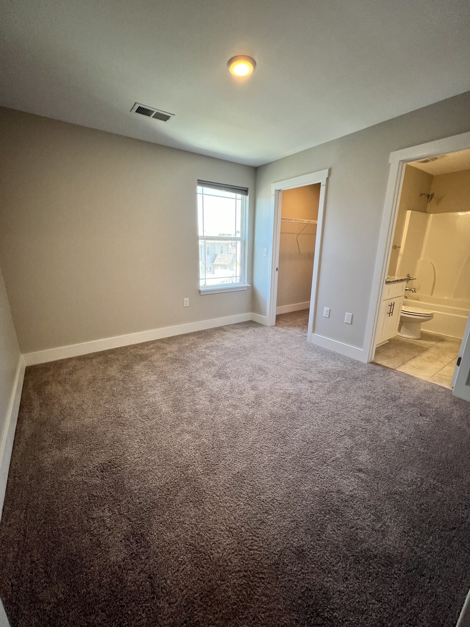 1056 Wells Way Spring Hill, TN 37174 - Photo 6 of 11 an empty room with a window