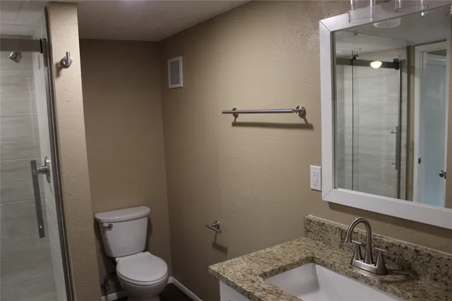 a bathroom with a sink and toilet