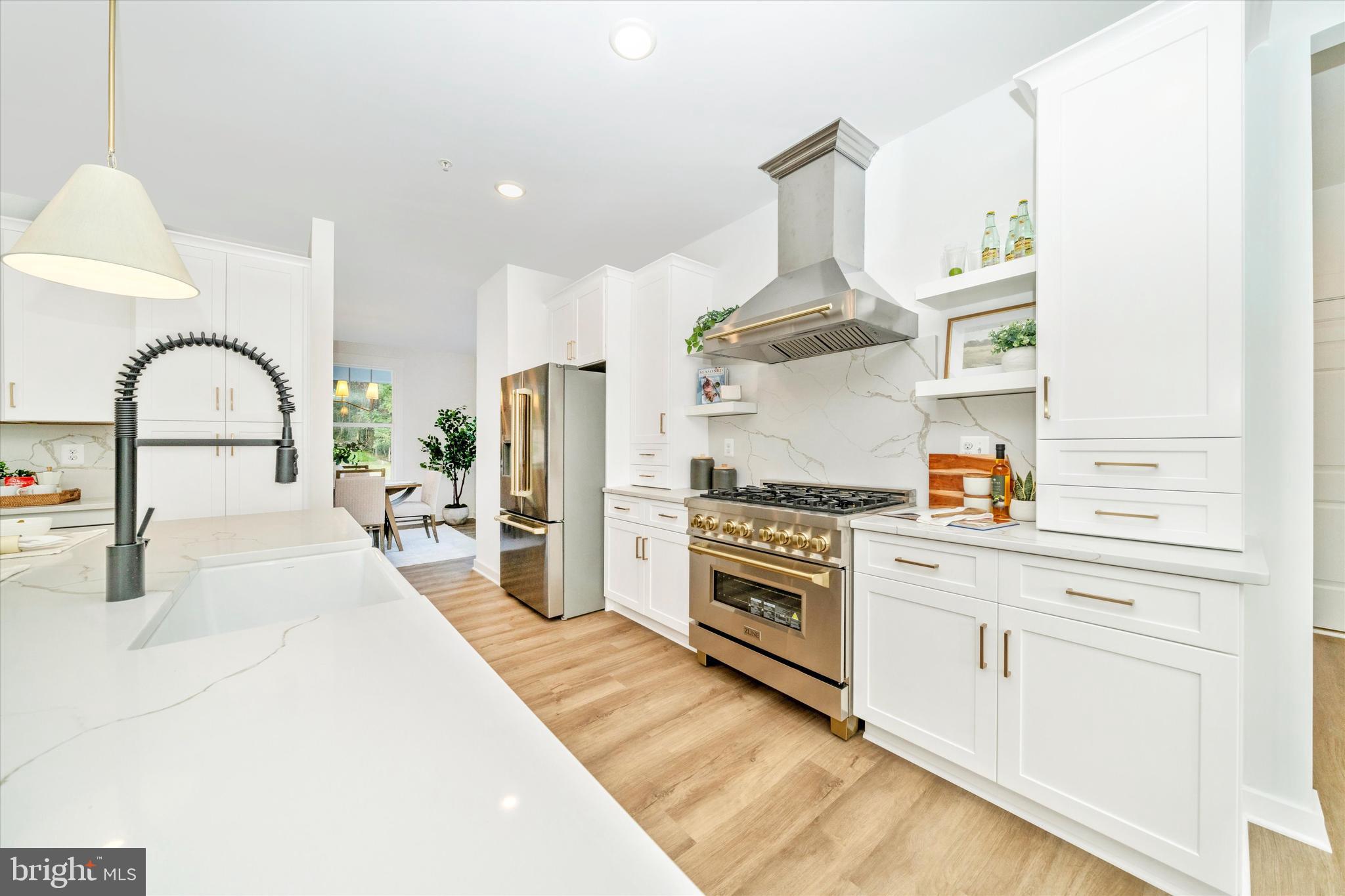 Old Bachmans Valley Road Westminster, MD 21157 - Photo 12 of 49 a kitchen with kitchen island stainless steel appliances a stove refrigerator sink and cabinets
