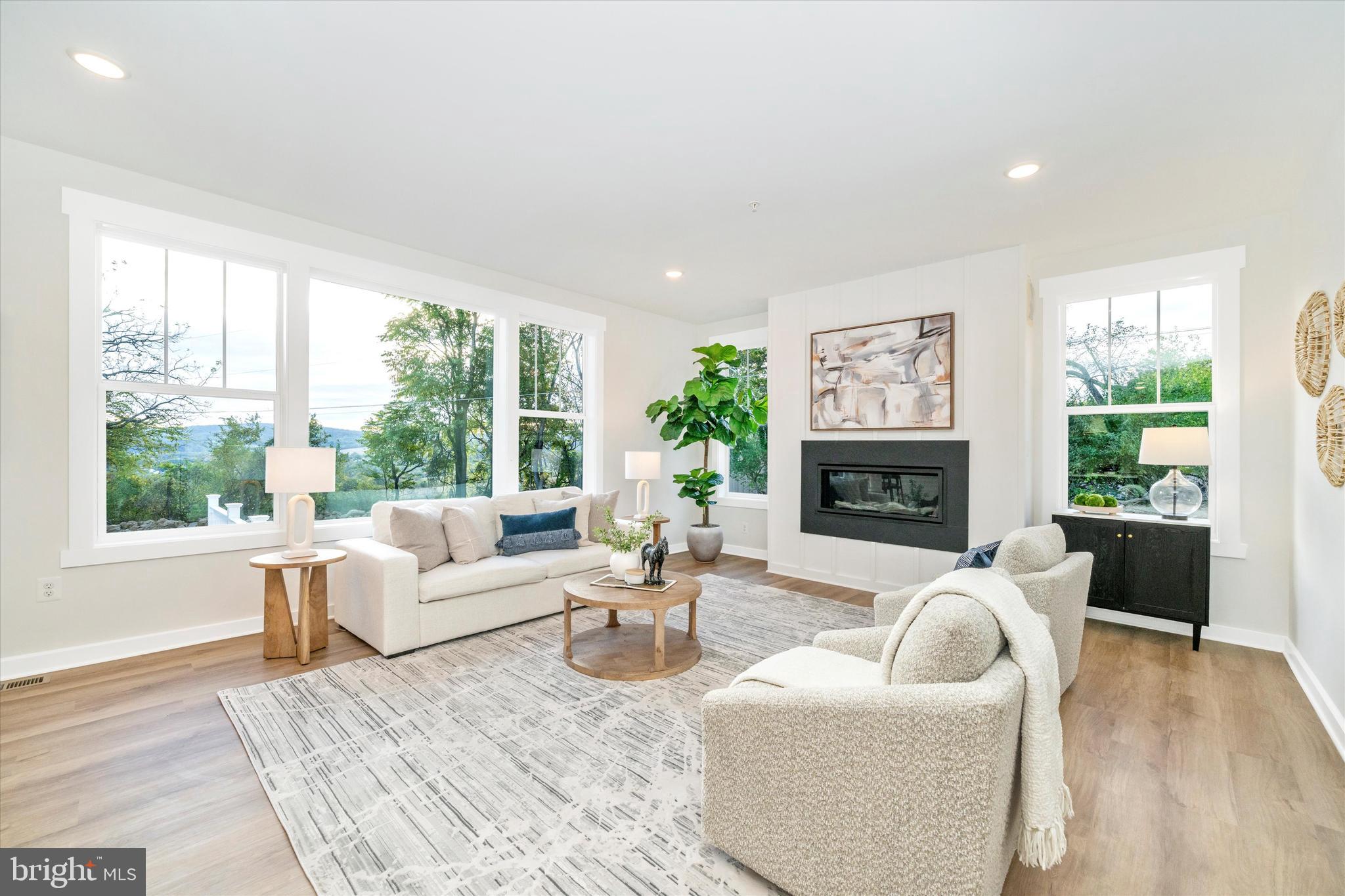 Old Bachmans Valley Road Westminster, MD 21157 - Photo 17 of 49 a living room with furniture a fireplace and a large window