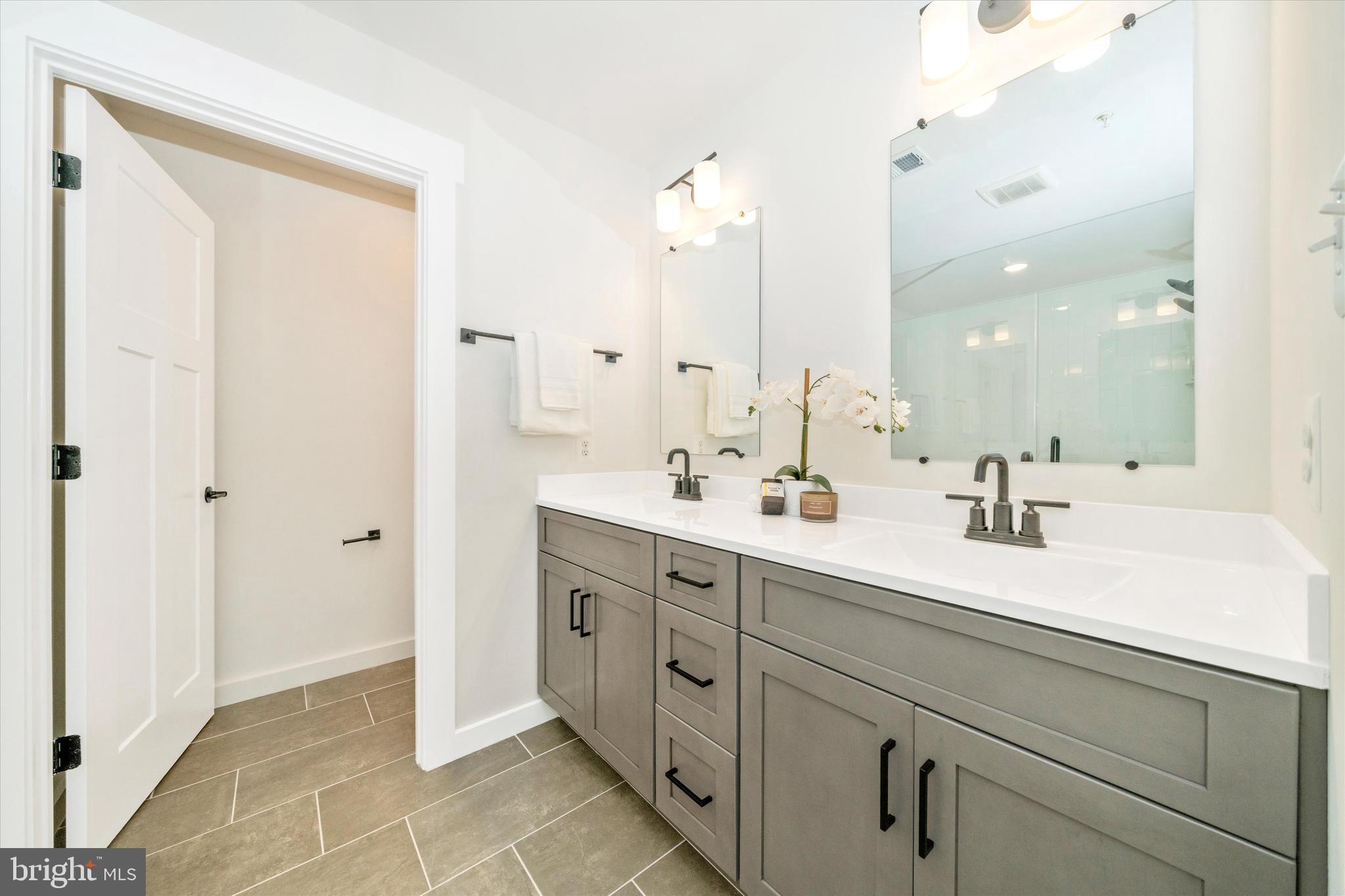 Old Bachmans Valley Road Westminster, MD 21157 - Photo 26 of 49 a spacious bathroom with a double vanity sink mirror and