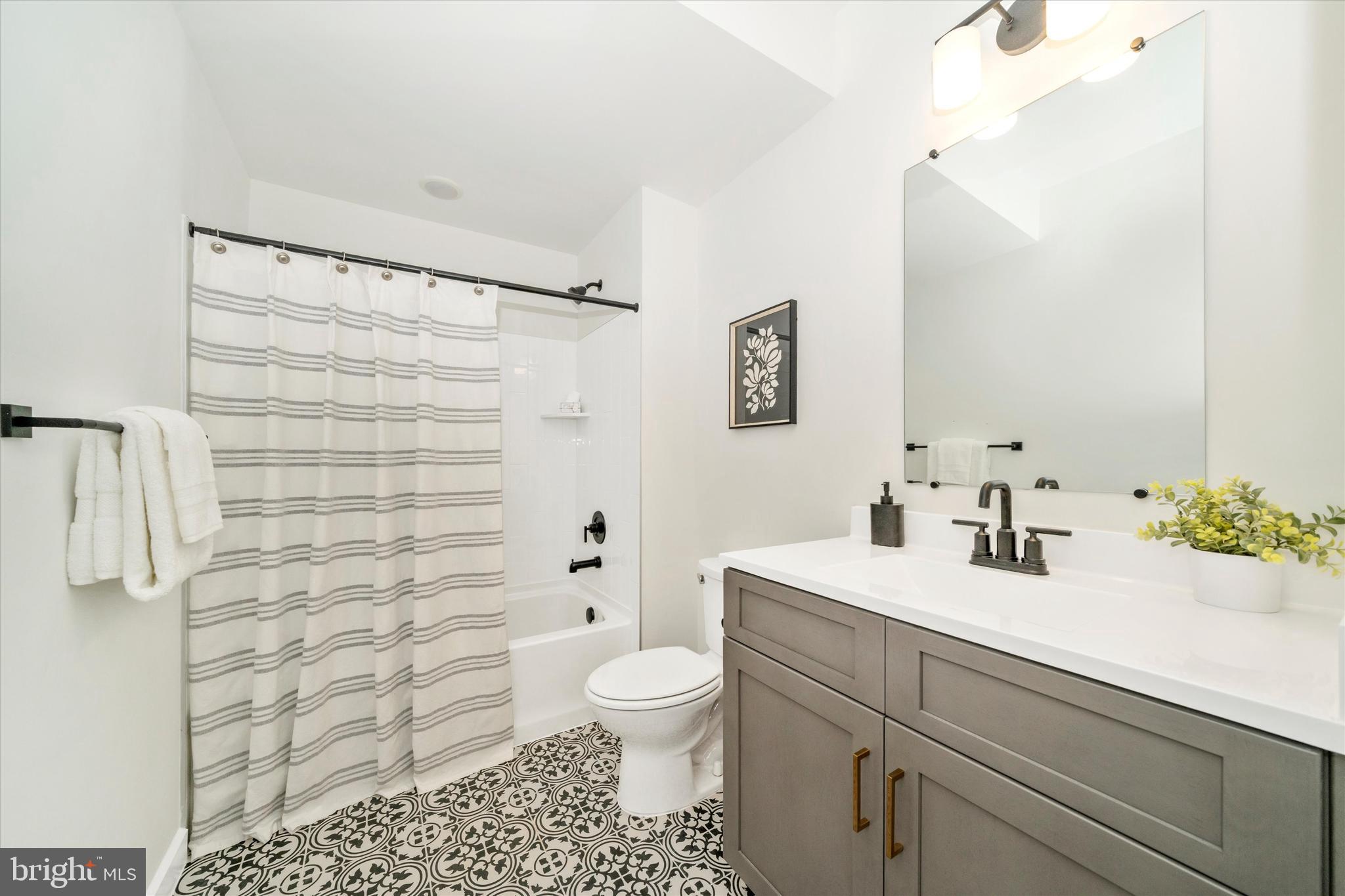 Old Bachmans Valley Road Westminster, MD 21157 - Photo 46 of 49 a bathroom with a sink a toilet and shower curtain