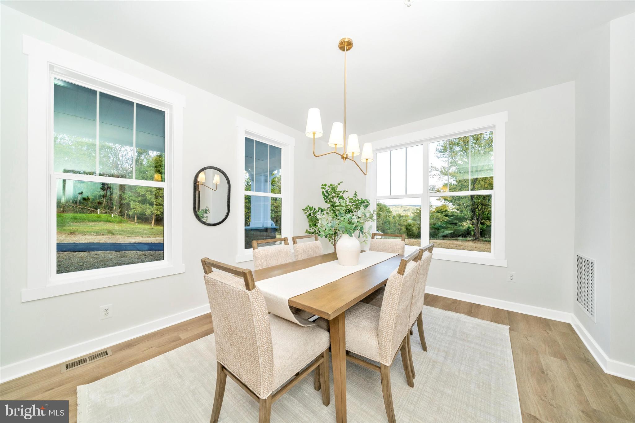 Old Bachmans Valley Road Westminster, MD 21157 - Photo 5 of 49 a dining room with furniture a chandelier and wooden floor
